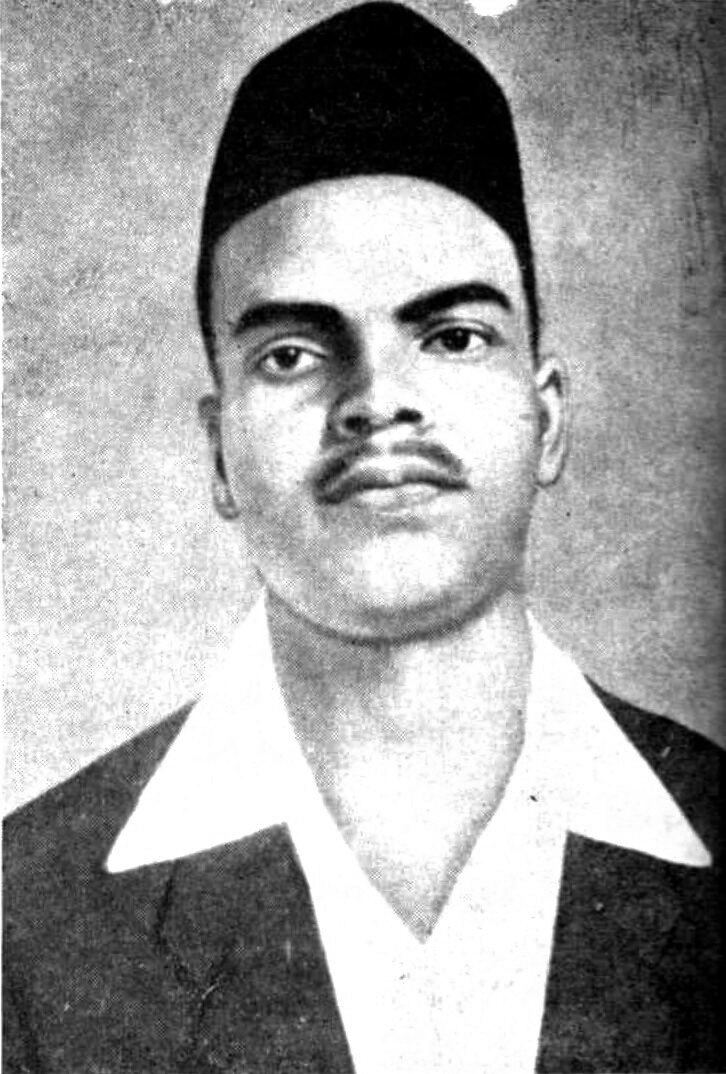 Archival black-and-white photographic portrait of Shivaram Hari Rajguru wearing a dark cap and a jacket over a white collar