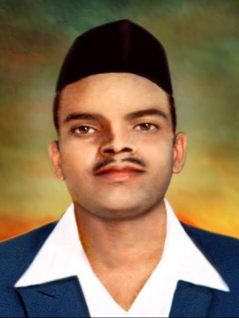 Colourised portrait of Shivaram Rajguru in a black cap, dark jacket and white shirt collar